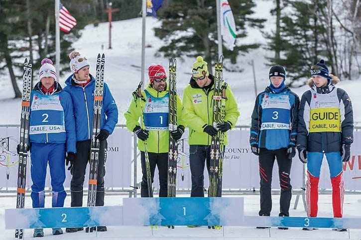 Brian McKeever (centre left) and Erik Carleton (centre right) on the IPC World Championships podium after winning the 20-kilometre skate. Crosss Country Canada photo