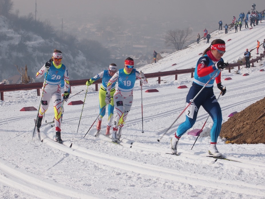 Canadian National Junior Team members Katherine Stewart-Jones (19) and Maya MacIsaac-Jones (29) chase Russia's Natalia Nepryaeva (2) in the quarterfinal of the 1.3 k classic sprint on the opening day of 2015 Junior World Championships in Almaty, Kazakhstan. Photo: Lisa Patterson CCC